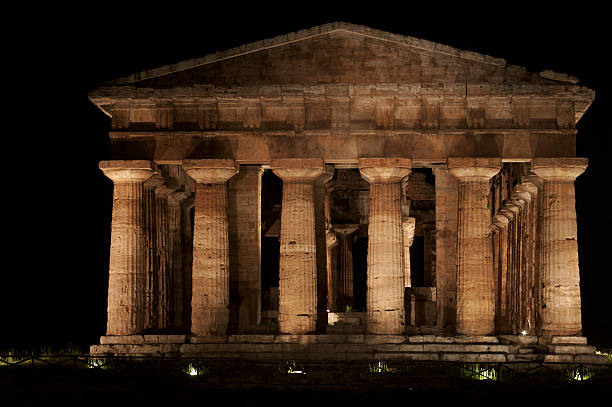 Paestum, Italy Greek Temples in Campania, Italy: Temple of Neptune (Poseidon) aka Temple of Hera II, night view of front with illumination temple of neptune doric campania italy stock pictures, royalty-free photos & images