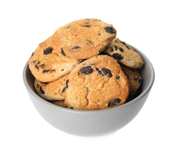 istock Delicious chocolate chip cookies in bowl isolated on white 1448743950