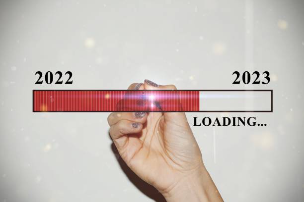 istock Woman hand with glitter nails showing the Loading Bar 1448749032