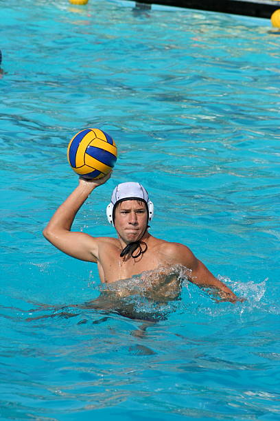 Water Polo Warm Up Water polo player warming up before a game. water polo photos stock pictures, royalty-free photos & images