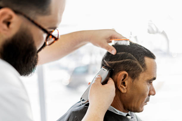 istock Hairdresser using electric razor 1448753016