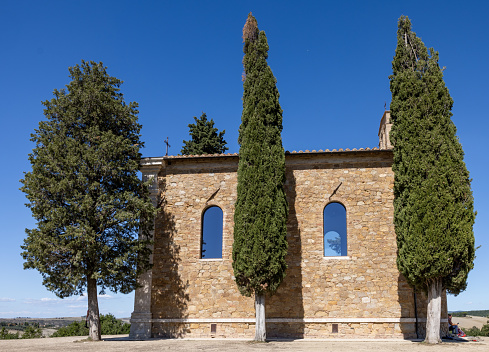 Pienza, Italy - September 12, 2022: Capella Di Vitaleta in countryside between San Quirico and Pienza in Val d Orcia Tuscany. Italy