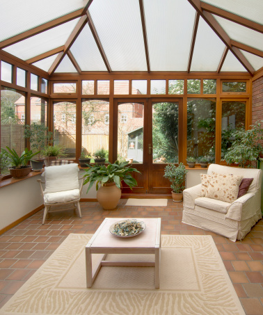 conservatory tables chairs plants room in house next to garden