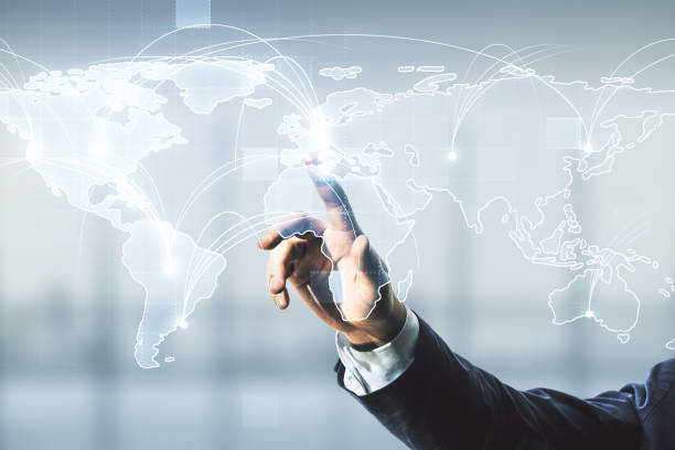 istock Man hand clicks on abstract graphic digital world map with connections on blurred office background, globalization concept. Multiexposure 1448765337