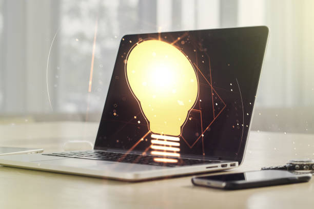 istock Creative idea concept with light bulb illustration on modern laptop background. Multiexposure 1448765347