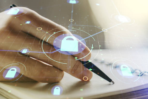 istock Creative lock sketch with chip hologram and man hand writing in notepad on background, protection of personal data concept. Multiexposure 1448765445