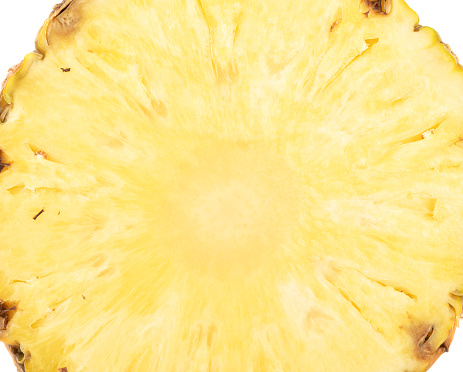 Abstract background from a slice of fresh ripe pineapple. Copy space.