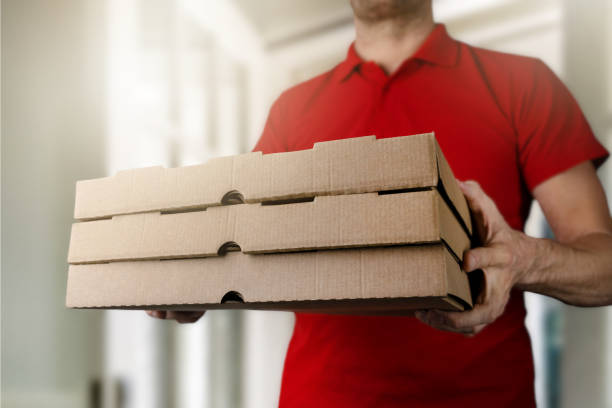 istock home pizza delivery. food courier deliver the order 1448767205
