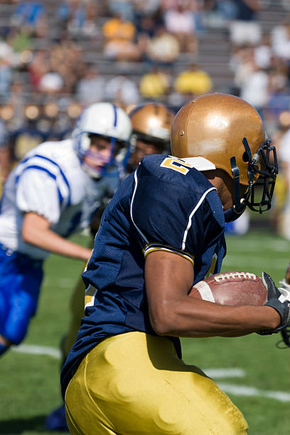 istock Running Back Carrying Football 144876874