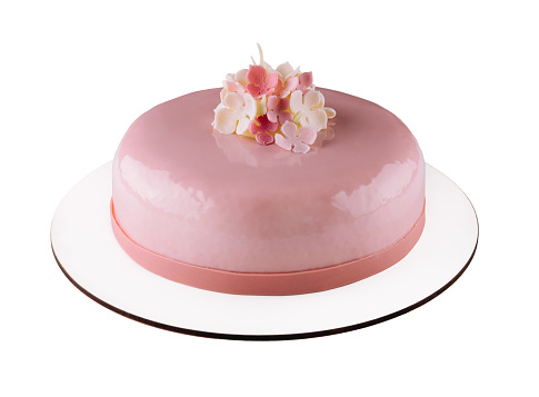 Pink mousse cakes decorated on white plate