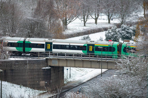 passenger train on bridge in southeast england in winter - southeast england imagens e fotografias de stock