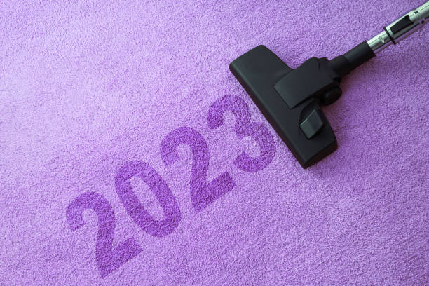 istock 2023 New year home cleaning with vacuum cleaner and copy space for a text 1448771782