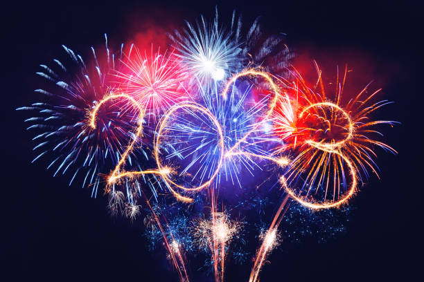 istock Sparkler firework illumination on black background and text Happy new year 1448771923