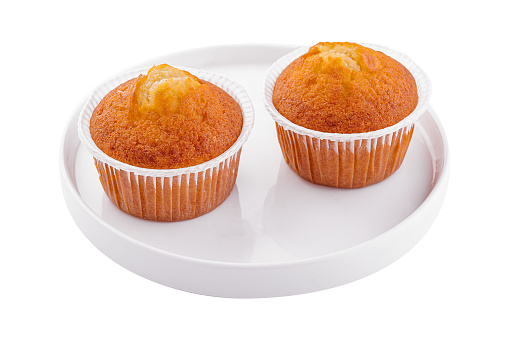 homemade muffins or cupcakes isolated on white background