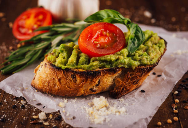 istock Homemade bruschetta with pesto sauce on rustic background 1448772712