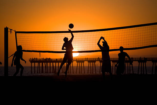 Volleyball players at sunset, 10th St. in Hermosa Beach stock photo