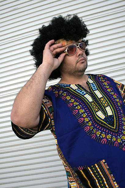 istock Hippie man holding sunglasses 144877325
