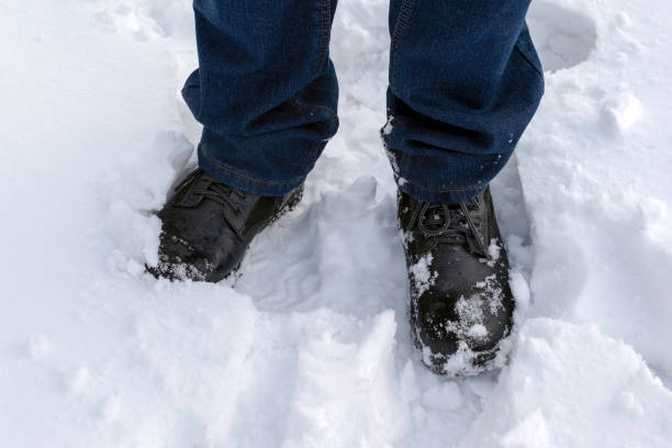 istock A man walks in the snow,deep snow, snowdrift. 1448774386