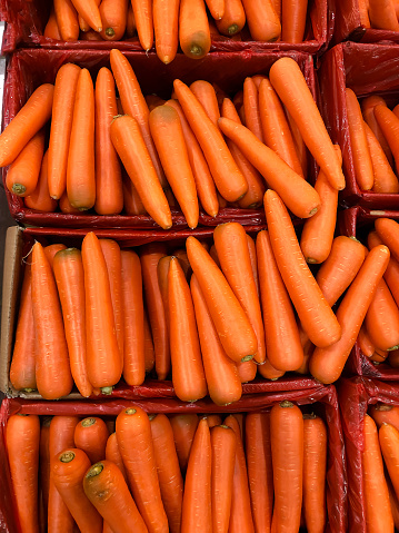 Many carrots at a market
