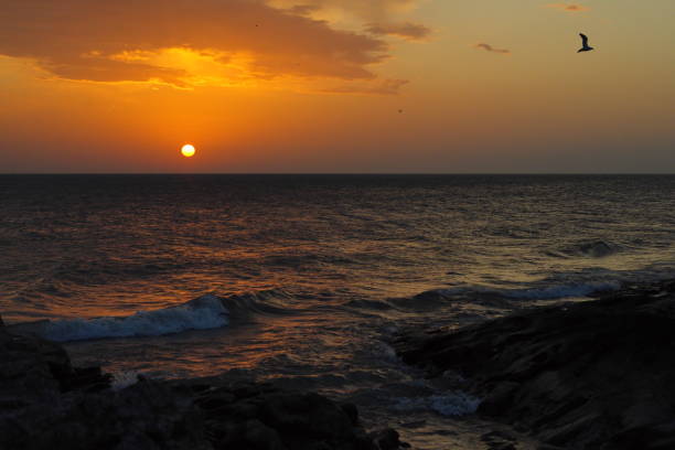 Russia. East Caucasus, Republic of Dagestan. Spring dawn on the shore of the Caspian Sea near the embankment of the city of Makhachkala.