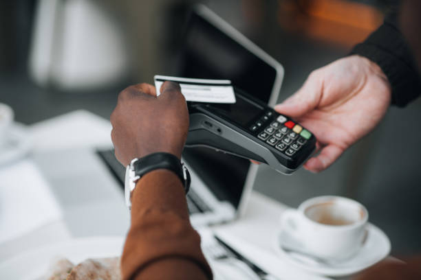 istock Man paying for lunch with his credit card 1448777200