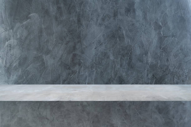 istock Concrete shelves table isolated on dark loft background and display montage for product. 1448778173