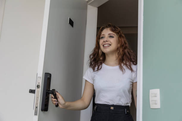 istock White woman opening electronic door 1448778504