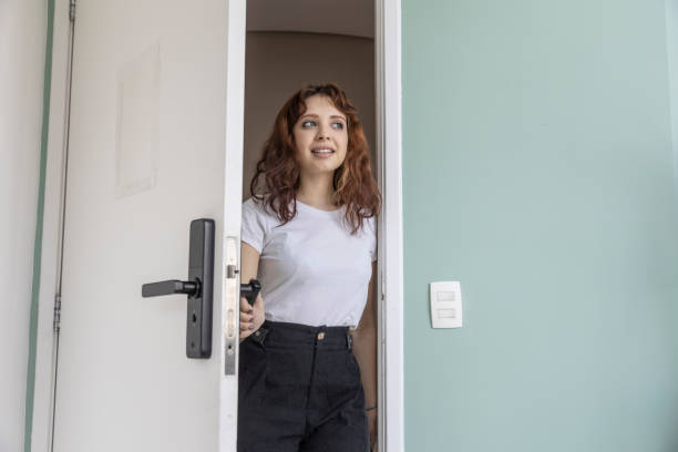 istock White woman opening electronic door 1448778514
