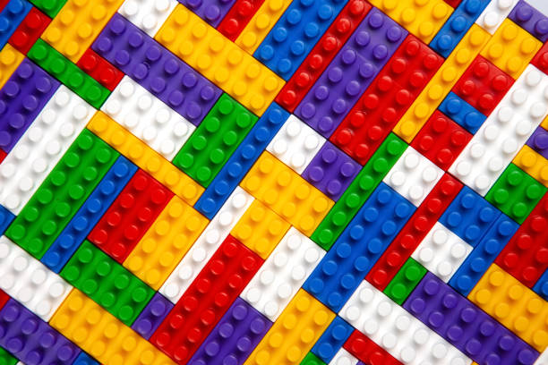 istock Abstract background texture of colored constructor blocks. Background of colorful plastic part of constructor. Pile of colored toy bricks. 1448778518