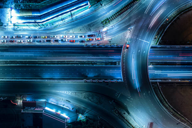 istock Expressway top view, Road traffic an important infrastructure, Drone aerial view fly in circle, traffic transportation, Public transport or commuter city life concept of economic and energ, transport. 1448780068