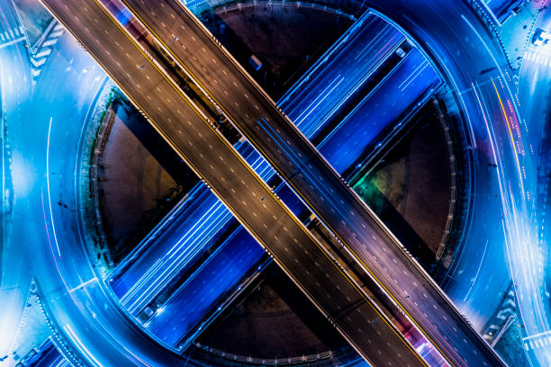 istock Expressway top view, Road traffic an important infrastructure, Drone aerial view fly in circle, traffic transportation, Public transport or commuter city life concept of economic and energ, transport. 1448780082