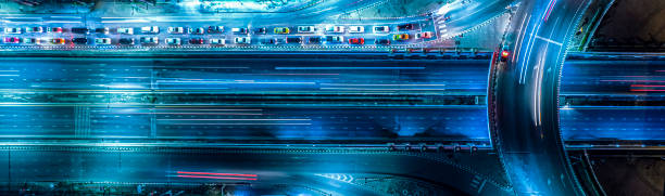 istock Expressway top view, Road traffic an important infrastructure, Drone aerial view fly in circle, traffic transportation, Public transport or commuter city life concept of economic and energ, transport. 1448780089