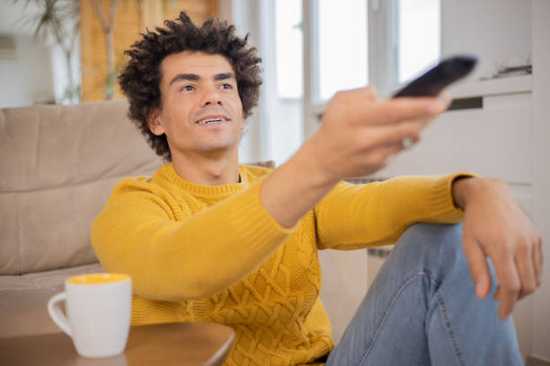 istock Man watching TV 1448780364