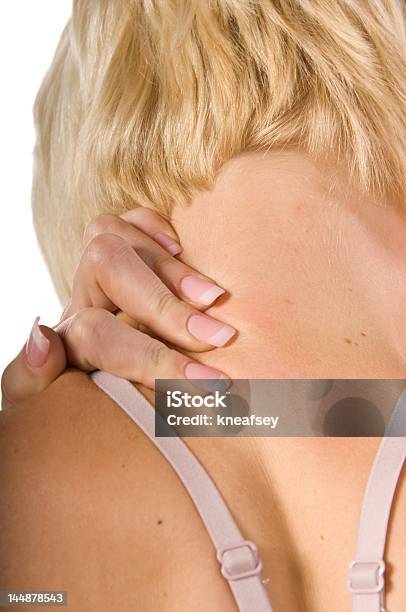 Woman With Back And Neck Ache Rubbing Area Stock Photo - Download Image Now - Adult, Adults Only, Back