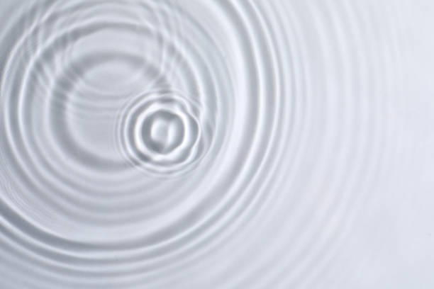 istock Closeup view of water with circles on light background 1448787009