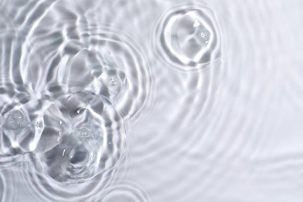 istock Closeup view of water with circles on light background 1448787728