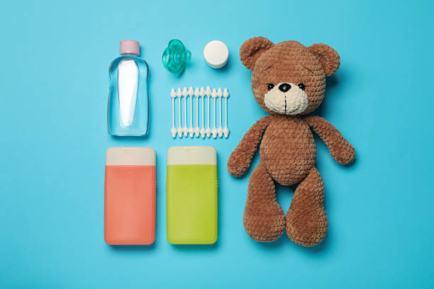 istock Flat lay composition with baby cosmetic products on light blue background 1448788032