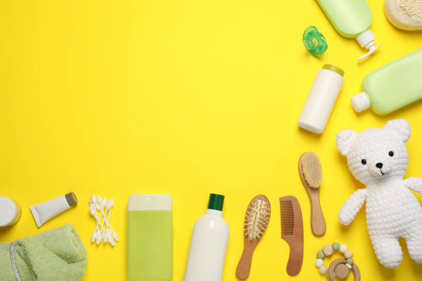 istock Flat lay composition with baby cosmetic products on yellow background, space for text 1448788360