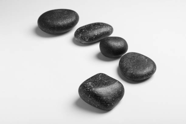 istock Group of different stones on white background 1448788916