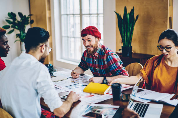 istock Collaborative process of creative young people smiling during friendly business meeting for brainstorming, happy multicultural group of designers research information during table cooperation 1448789083