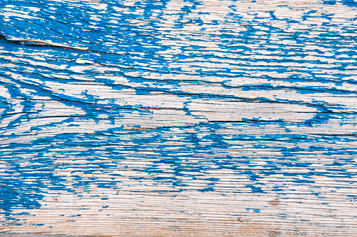 Faded blue paint on old wood texture