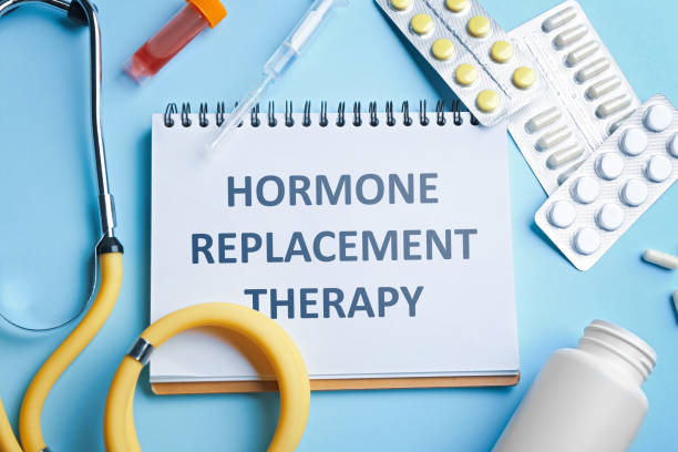 istock Notebook with text Hormone Replacement Therapy and medications on light blue background, flat lay 1448792560