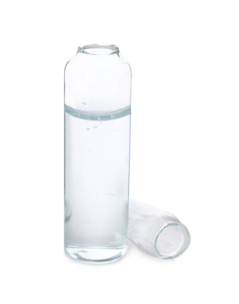 istock Open glass ampoule with pharmaceutical product on white background 1448793465