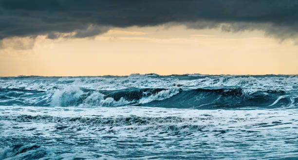 istock Storm sea waves with foam. Dramatic ocean landscape 1448794683