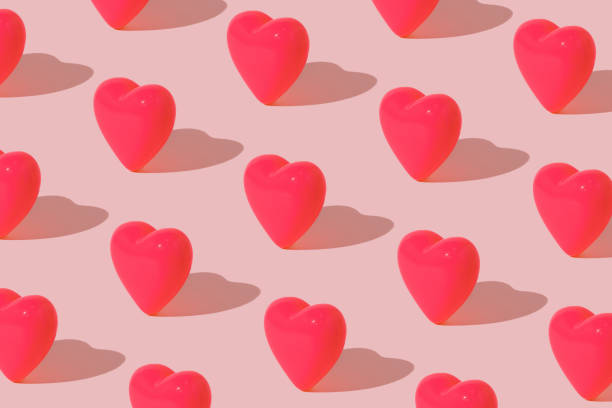 istock Pink hearts pattern on pastel background. Minimal Valentine's or love concept. 1448797414