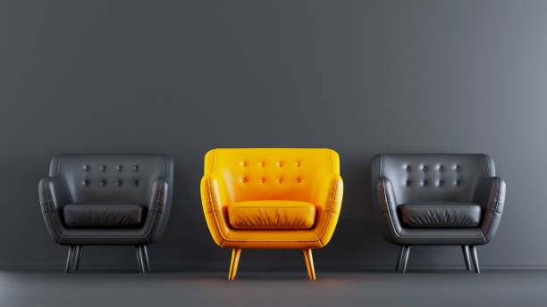 istock outstanding yellow sofa among black sofa on dark wall background. 1448799401