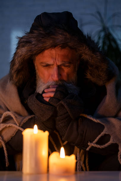 istock Senior man freezing at home 1448799793