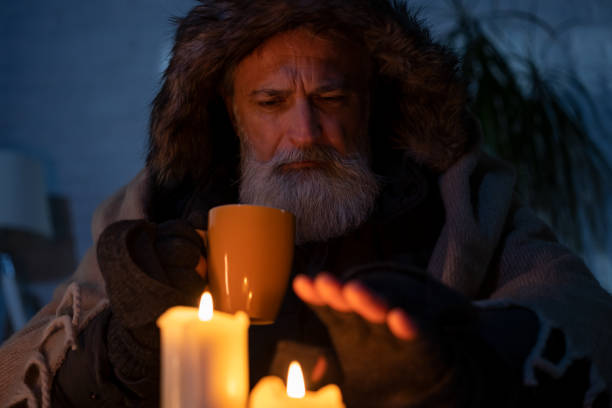 istock Senior man freezing at home 1448799832