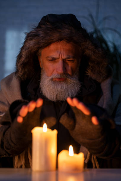 istock Senior man freezing at home 1448799856