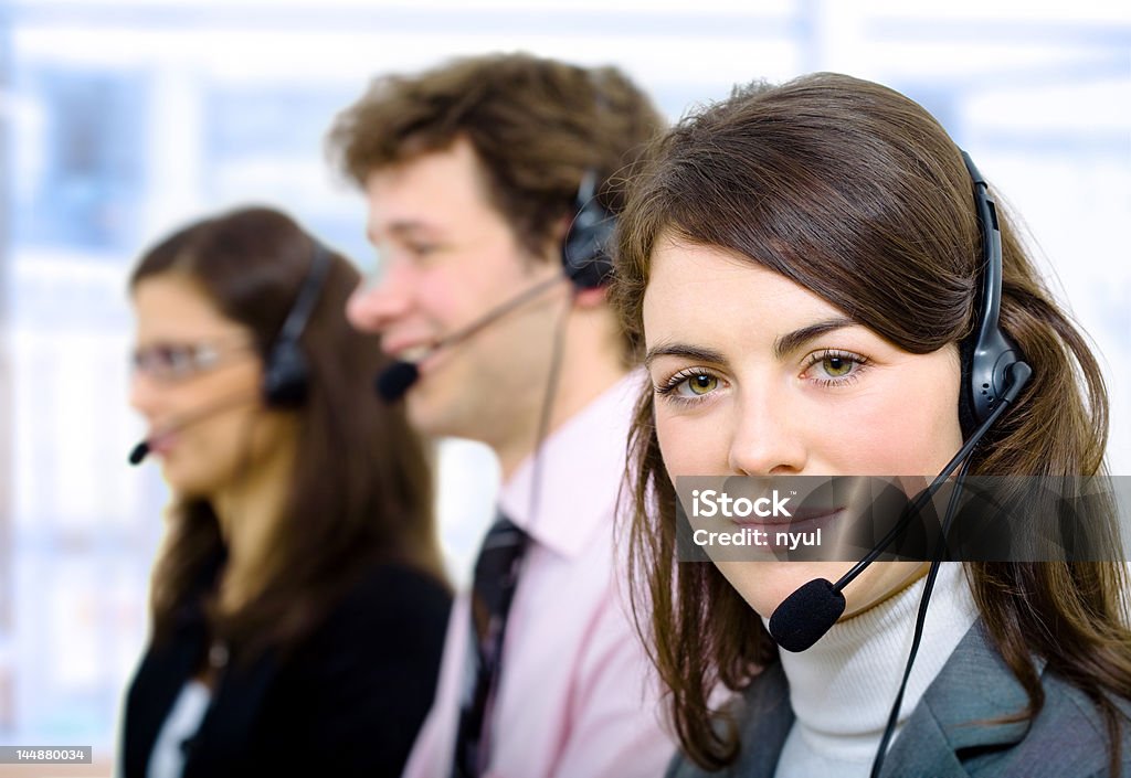 Helpdesk Customer service representatives working in headset. 20-24 Years Stock Photo